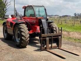 Photo 1. Manitou MT732 Telescopic Handler
