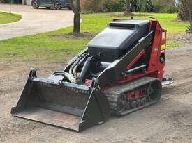 Photo 1. Toro TX525 Dingo Skid Steer Loader
