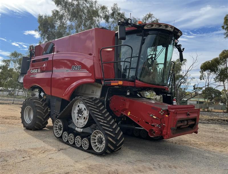 Case IH 8250 on track + MacDon D140 combine harvester