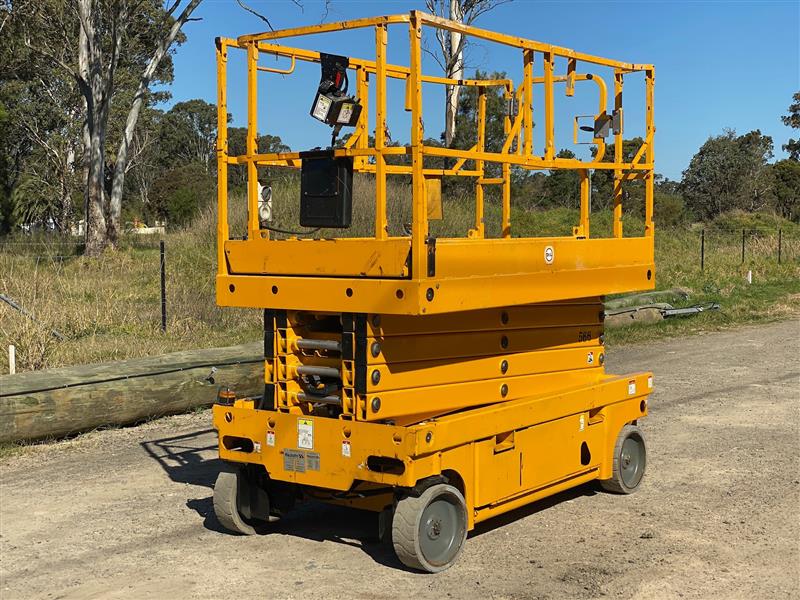 Photo 1. Haulotte Compact 12 12M electric scissor lift elevated work platform