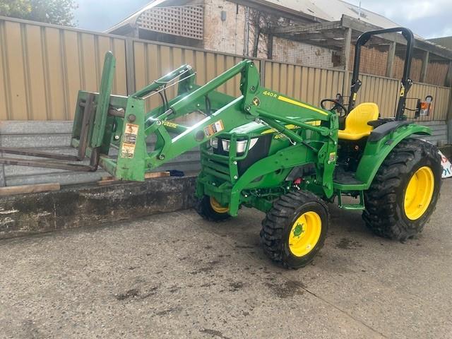 John Deere 4066M tractor with loader