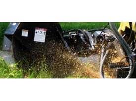 Photo 3. Digga stump grinder skid steer stump grinder attachments