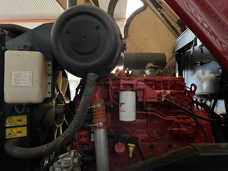 Photo 3. MacDon M205 windrower