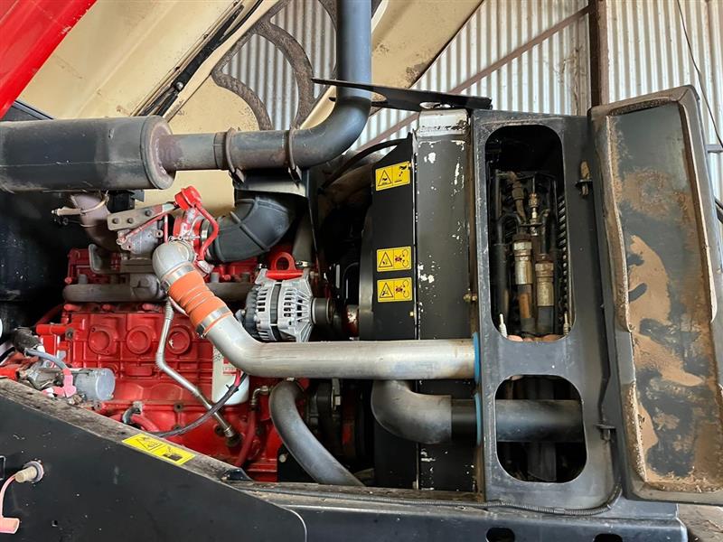 Photo 4. MacDon M205 windrower