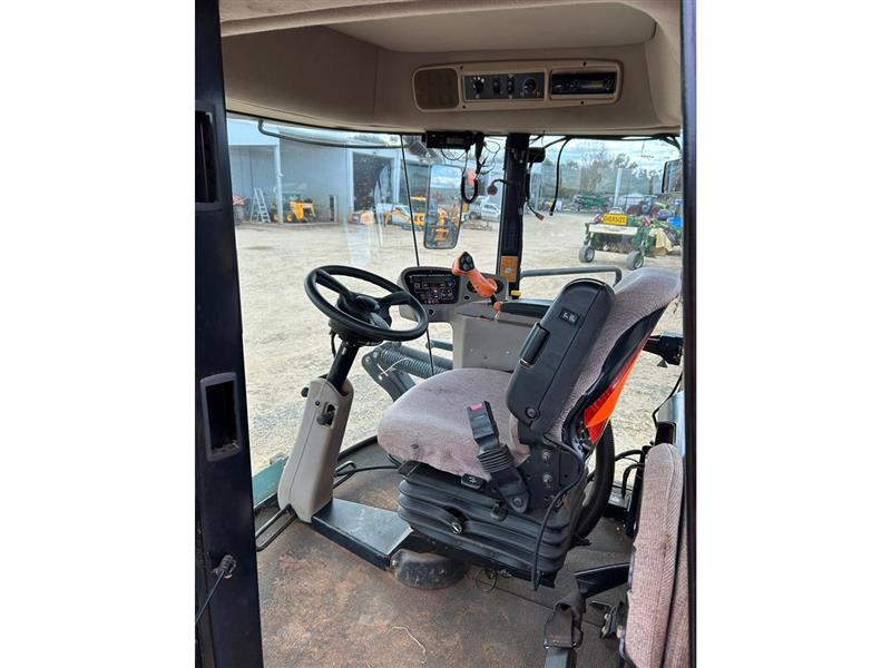 Photo 3. MacDon M150 windrower