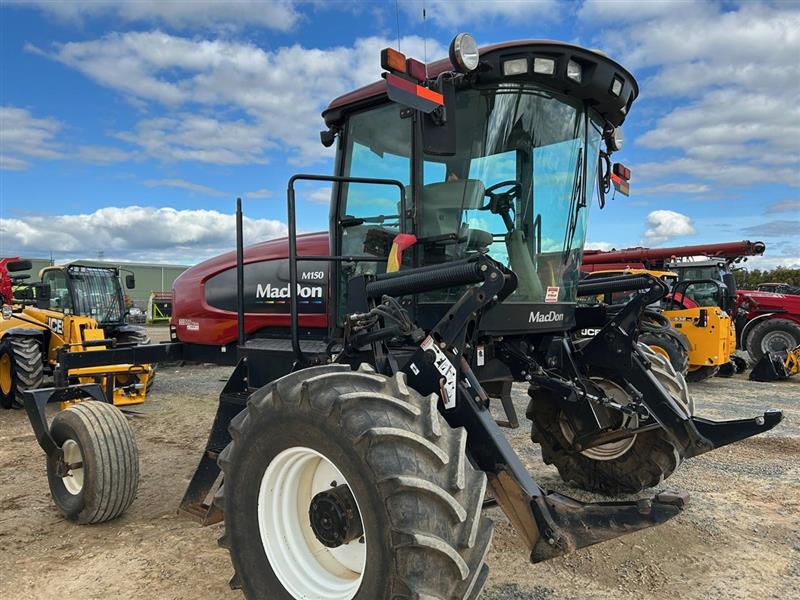 Photo 4. MacDon M150 windrower