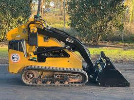 Photo 2. Vermeer SC650TX Skid Steer Loader