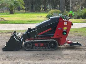 Photo 2. Toro TX525 Dingo Skid Steer Loader