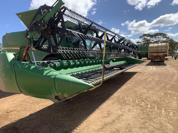 Photo 2. John Deere 640D harvester front