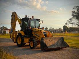 Photo 2. Komatsu WB97R-5 Backhoe Loader