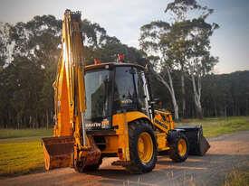 Photo 3. Komatsu WB97R-5 Backhoe Loader
