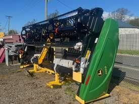 Photo 2. John Deere 420D windrower