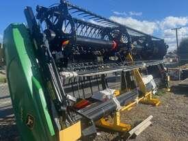 Photo 3. John Deere 420D windrower