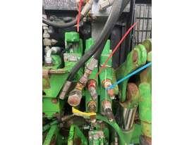 Photo 2. John Deere 640 tractor loaders