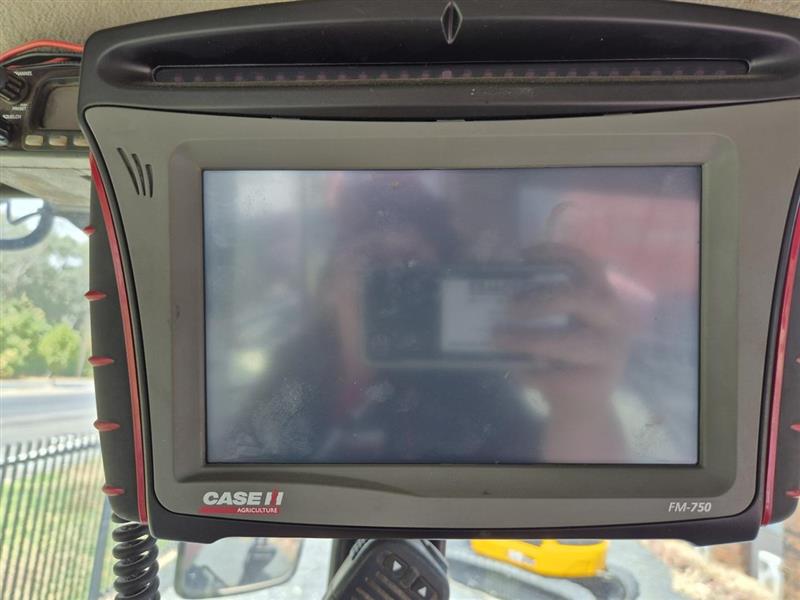 Photo 4. MacDon M205 windrower