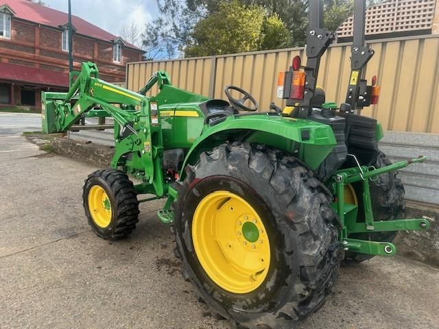 Photo 2. John Deere 4066M tractor with loader