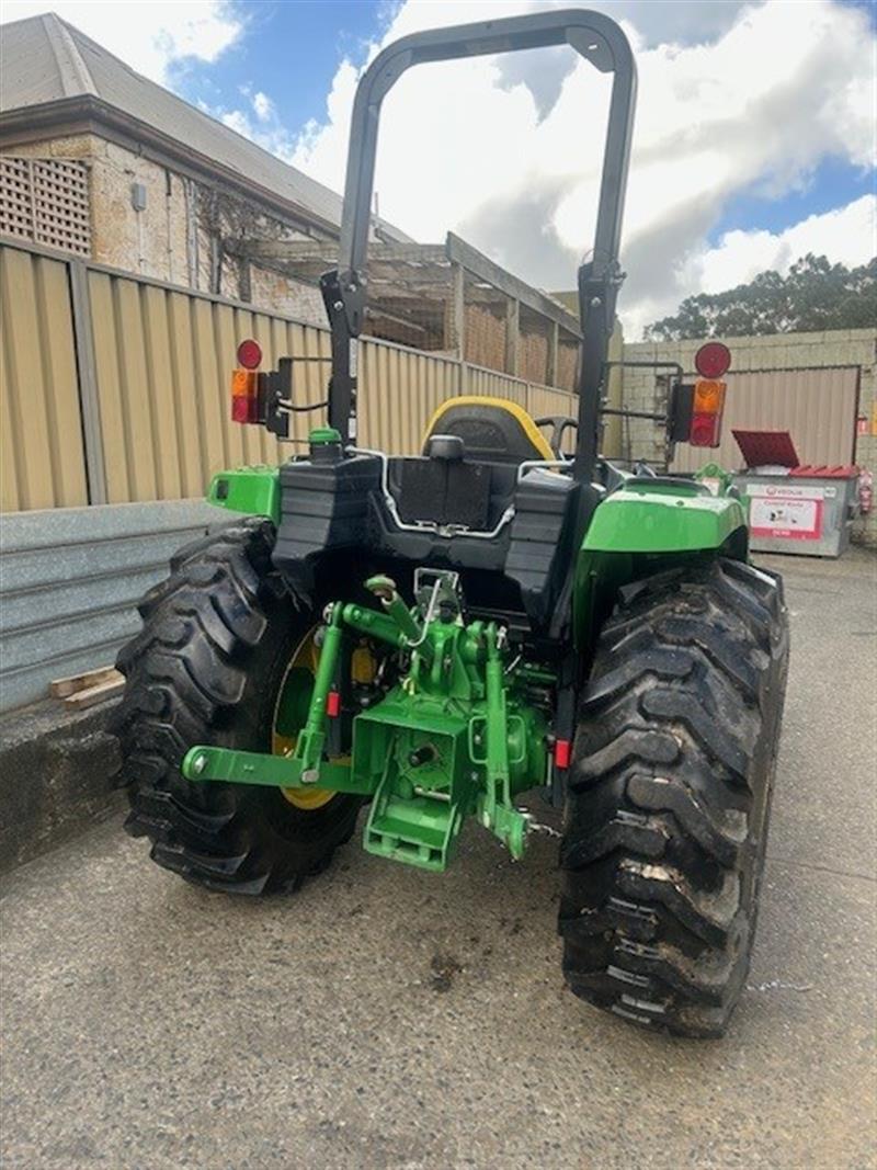 Photo 4. John Deere 4066M tractor with loader